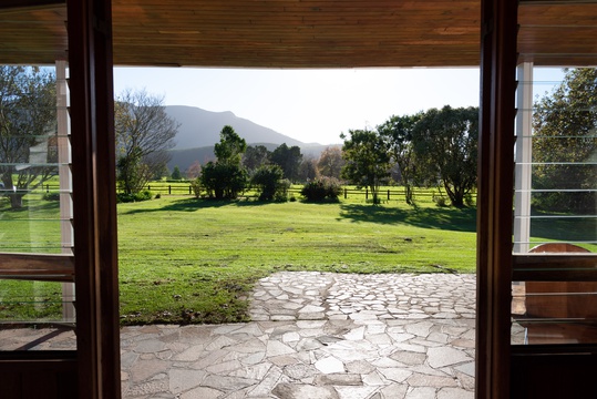 Views of the dairy farm fields with  the Tsitsikamma mountains in the background from the front door of Natures Way Farmhouse