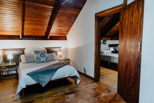 Large bedroom 1 with double bed, large closets, a chest and forest views at The Wooden Forest House